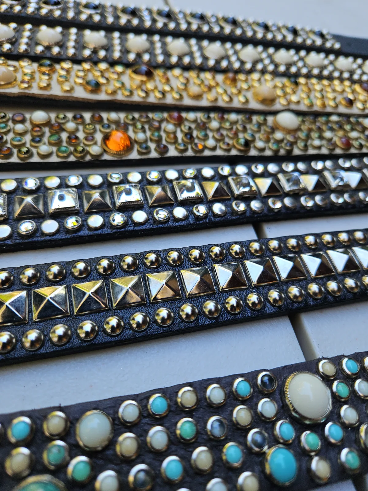 RN Design leather collars with rows of decorative studs in varied shapes and colors